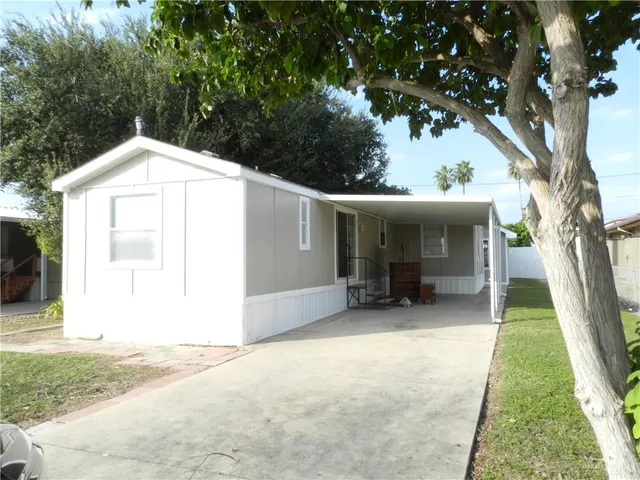 a view of a house with a sink and backyard