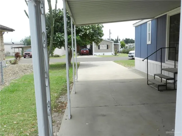 a view of a back yard of the house