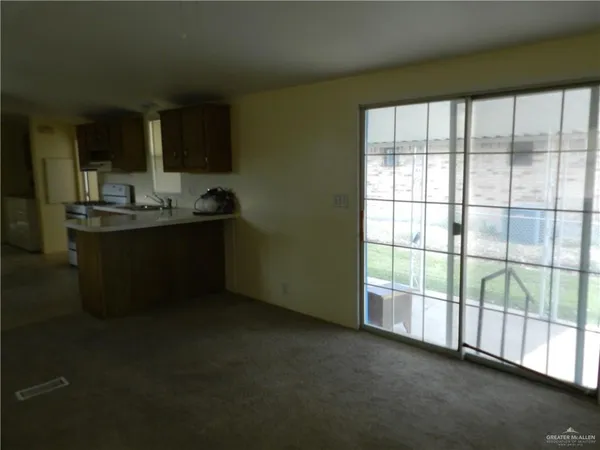 a view of a kitchen with a sink