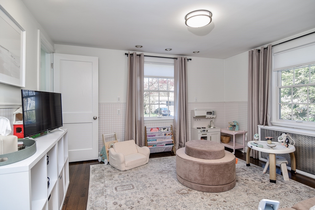 52 Wesley Road Framingham, MA 01701 - Photo 13 of 29 a living room with furniture and a flat screen tv