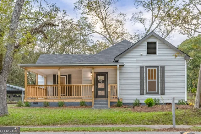 a front view of a house with a yard