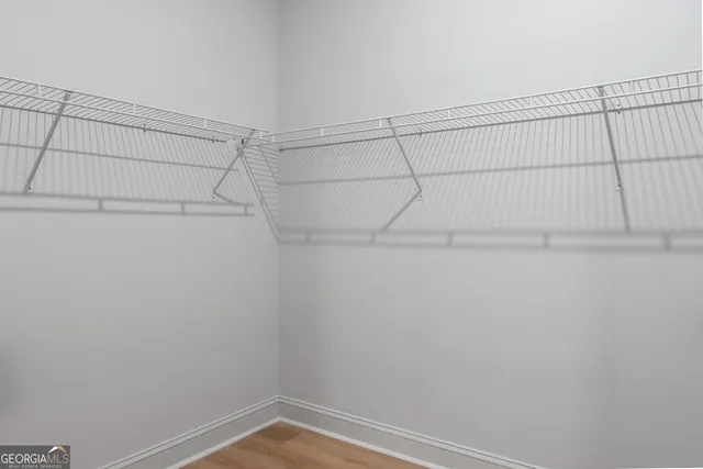 a view of a livingroom with a furniture chandelier fan and fire place