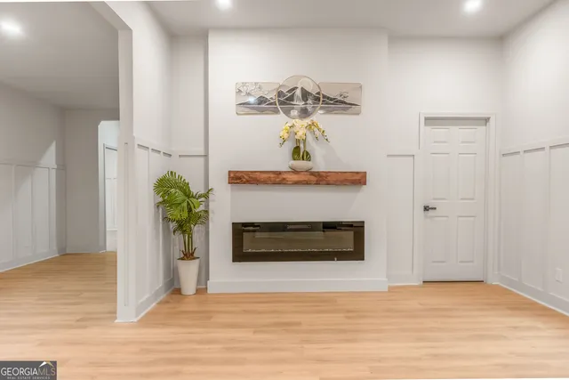 a kitchen with stainless steel appliances granite countertop a stove a sink and a chandelier
