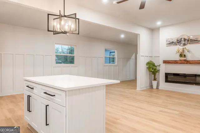 a large kitchen with cabinets and stainless steel appliances