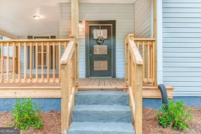 a front view of a house with a porch