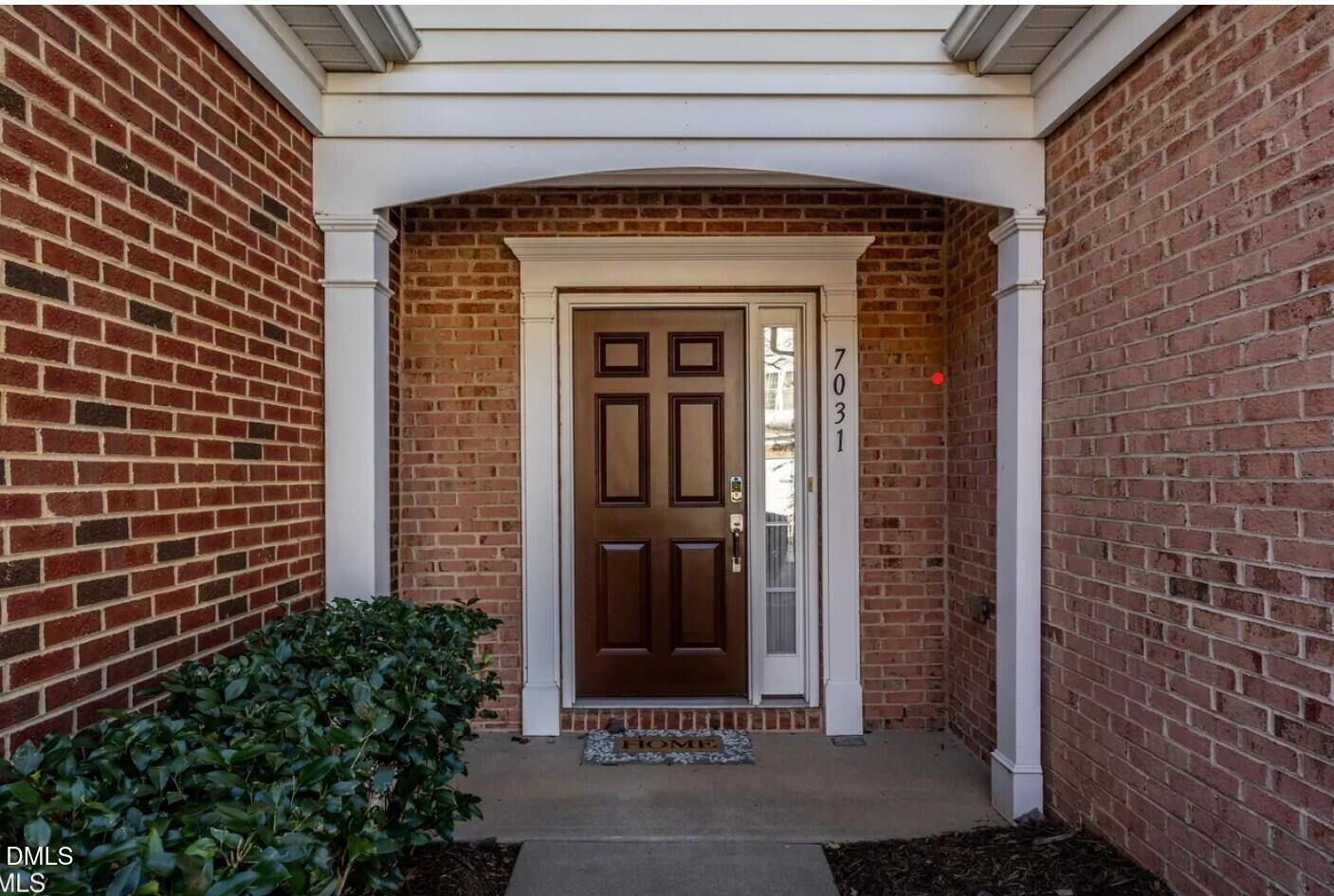 7031 Racine Way Raleigh, NC 27615 - Photo 2 of 24 a view of a door of the house