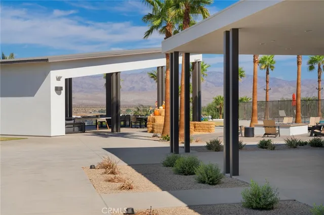 a very nice looking room with a large window and a chandelier