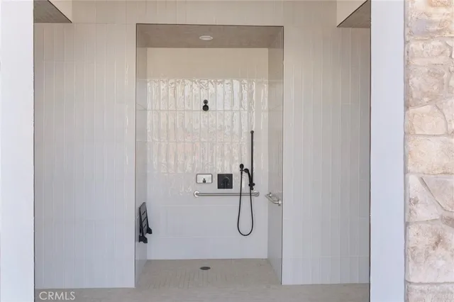 a bathroom with a glass shower door