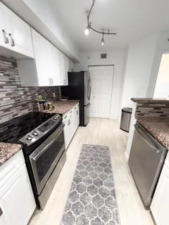a kitchen with a stove and a microwave