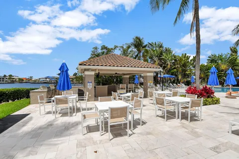 a view of a patio with table and chairs