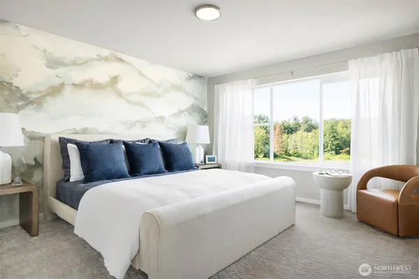 a bedroom with bed and a large window