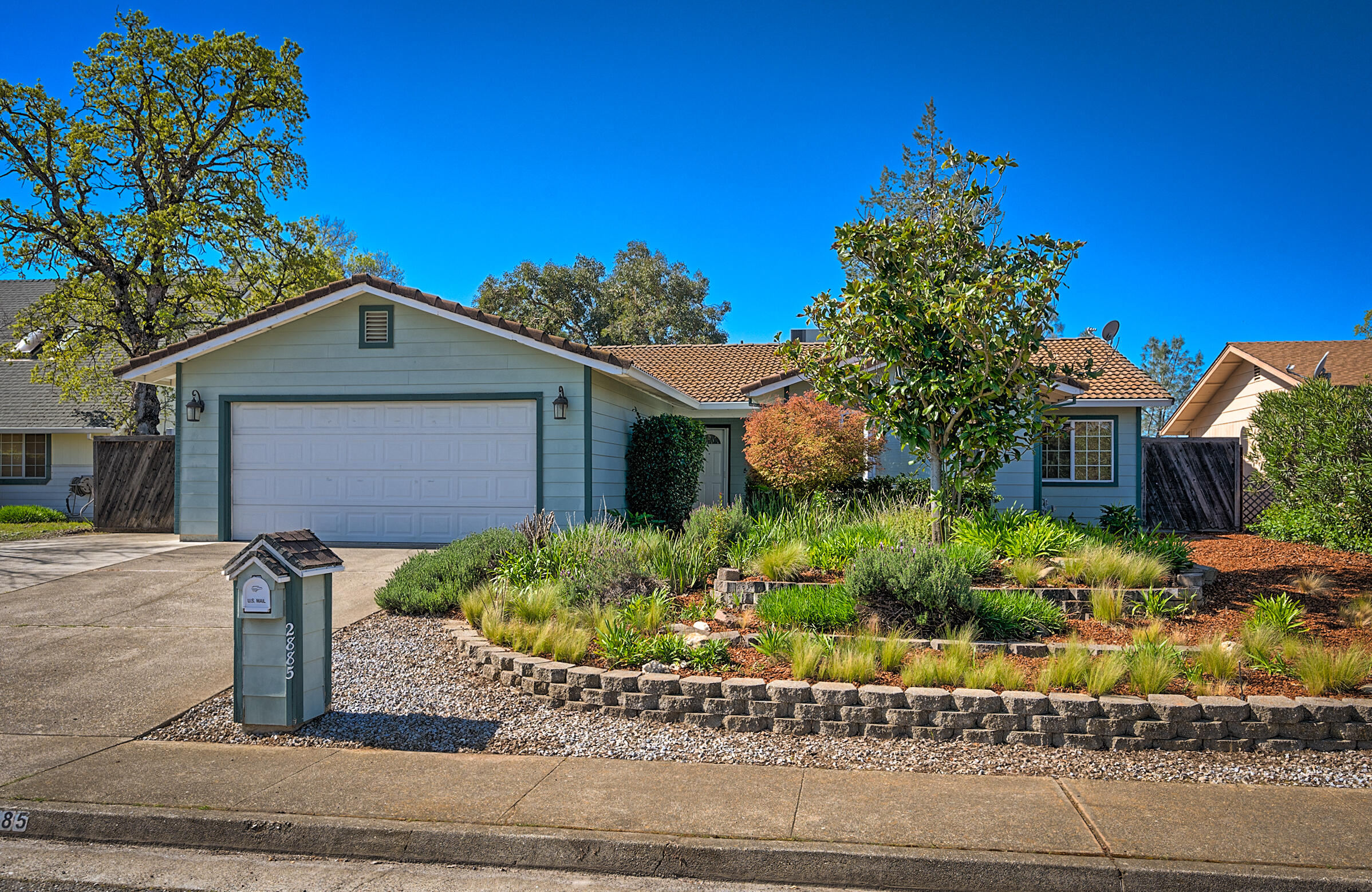 a front view of a house with garden