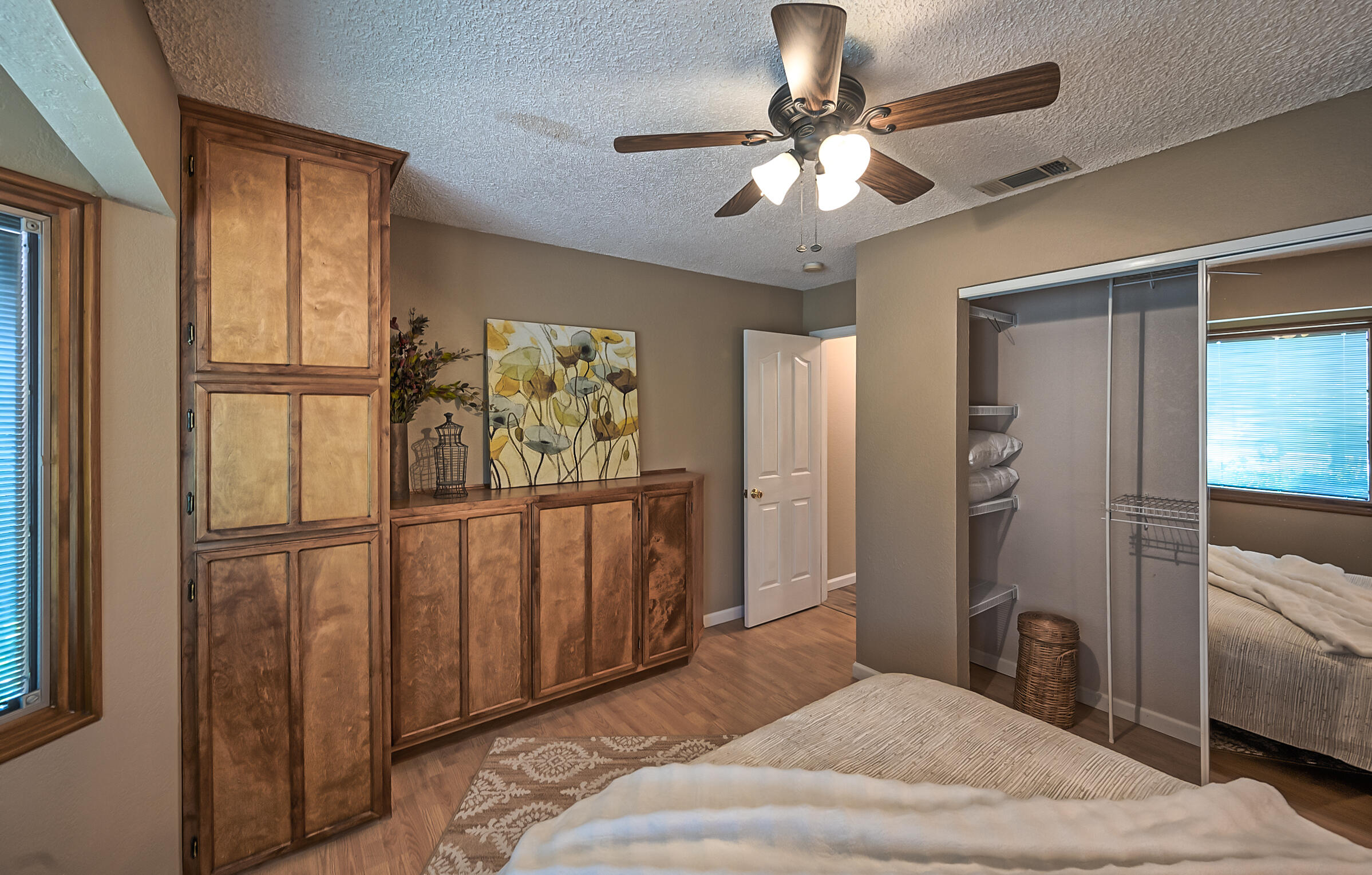 2885 Starlight Boulevard Redding, CA 96001 - Photo 28 of 51 a bedroom with a bed and a chandelier