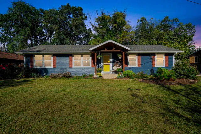 a front view of a house with a yard