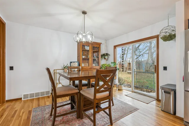 a living room with a bed furniture and a flat screen tv