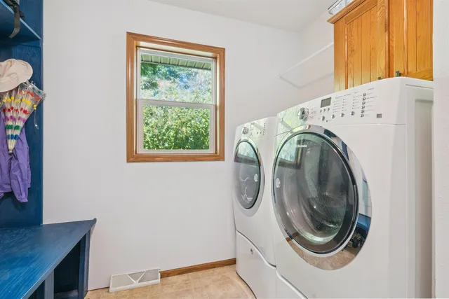 a utility room with dryer and washer