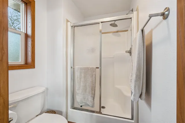 an aerial view of residential building and lake