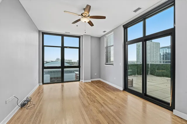 a bedroom with a large bed and a large window