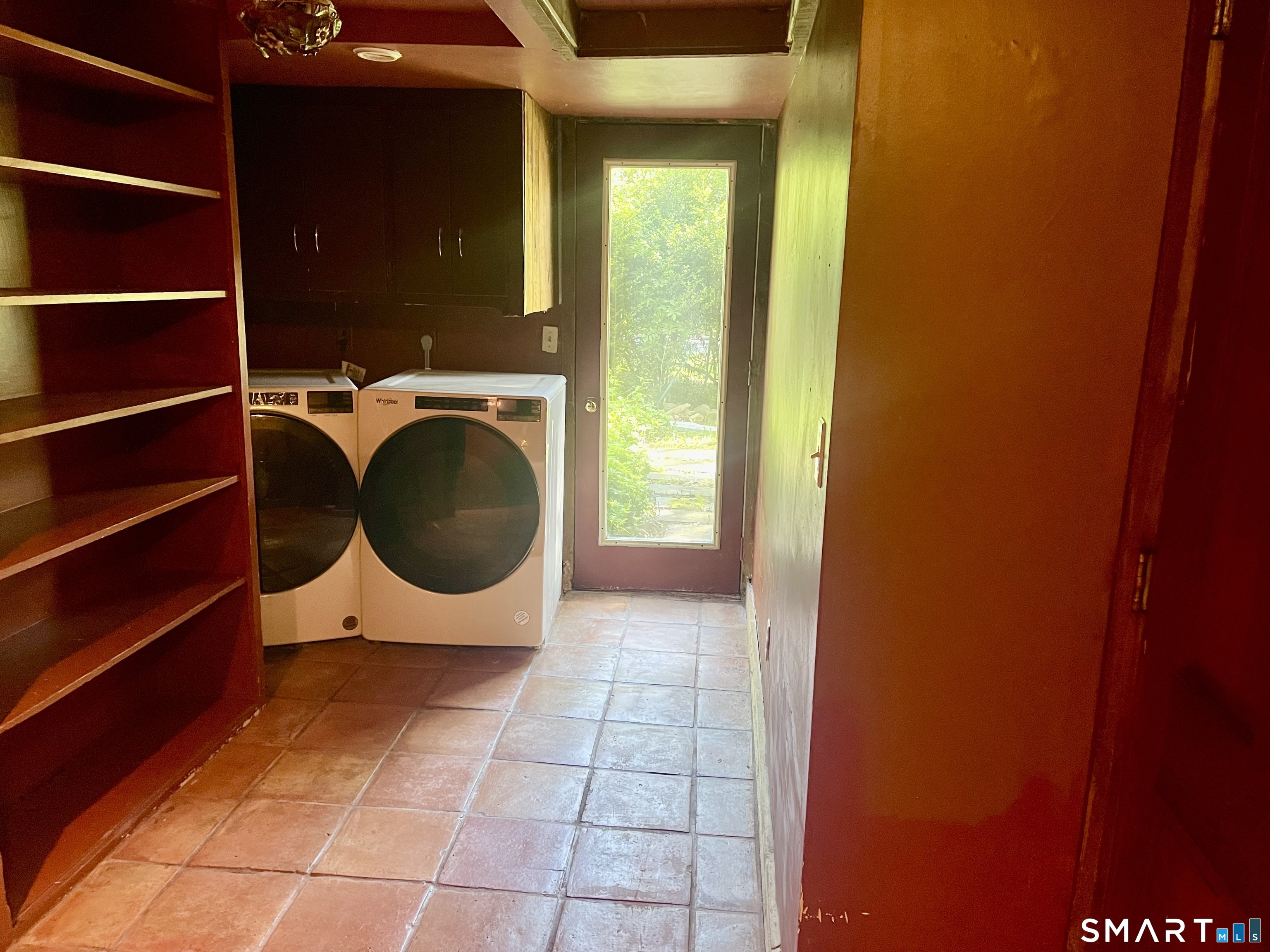 11 Tubbs Spring Drive Weston, CT 06883 - Photo 28 of 36 Laundry room has a door into the basement and door to the front yard