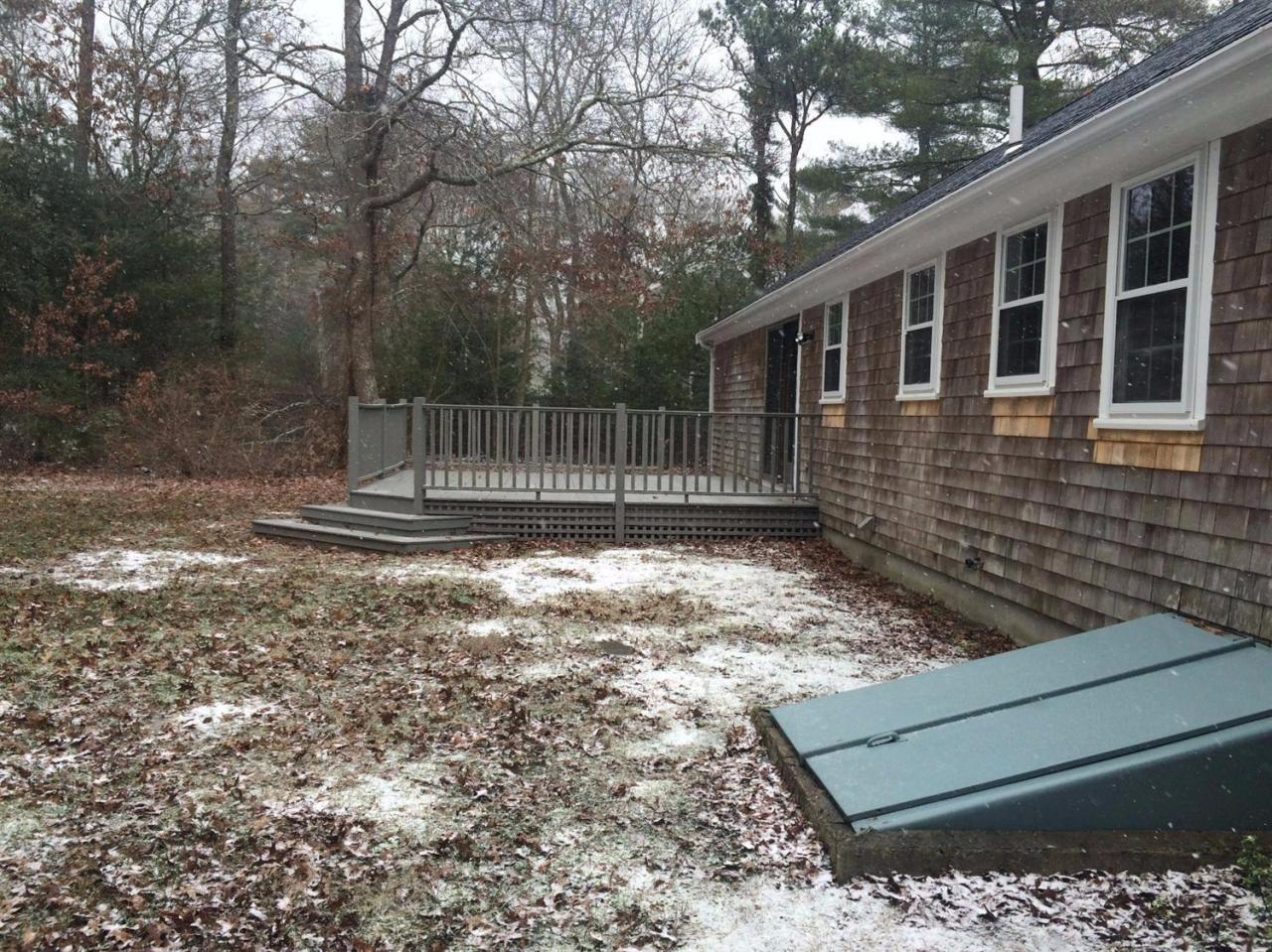 48 North Precinct Road Centerville, MA 02632 - Photo 4 of 28 a view of a yard with wooden fence and trees