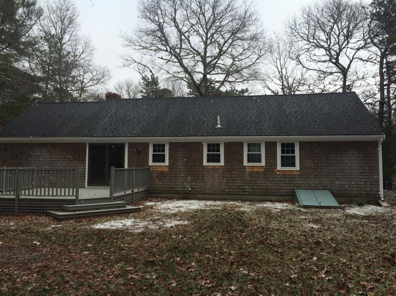 48 North Precinct Road Centerville, MA 02632 - Photo 5 of 28 a front view of a house with a yard
