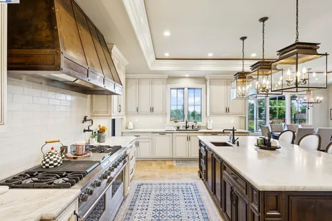 a view of a kitchen cabinets and a stove