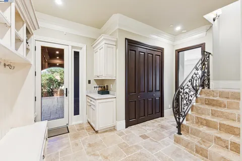 a large bathroom with a double vanity sink a large mirror and shower