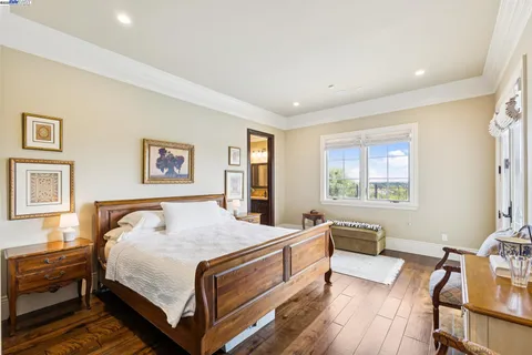 a bathroom with a bathtub sink and mirror