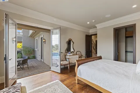 a spacious bathroom with a granite countertop sink mirror and bathtub