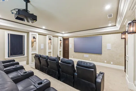 a spacious bathroom with a granite countertop sink a mirror and shower