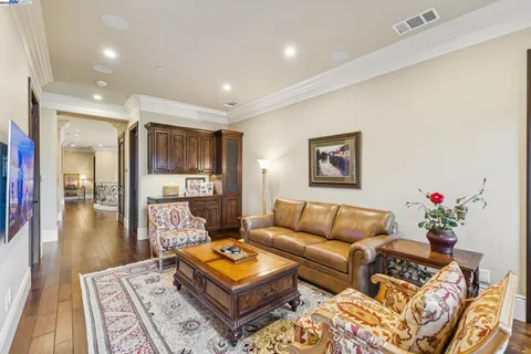 a kitchen with stainless steel appliances granite countertop a cabinets and a book shelf