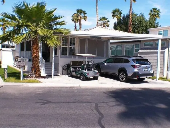 a view of a car parked in front of a building