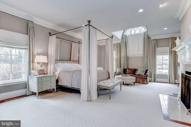 a bedroom with furniture and a chandelier