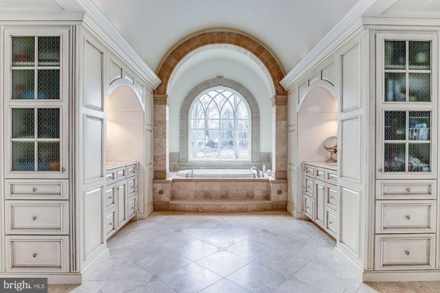 a large white kitchen with windows