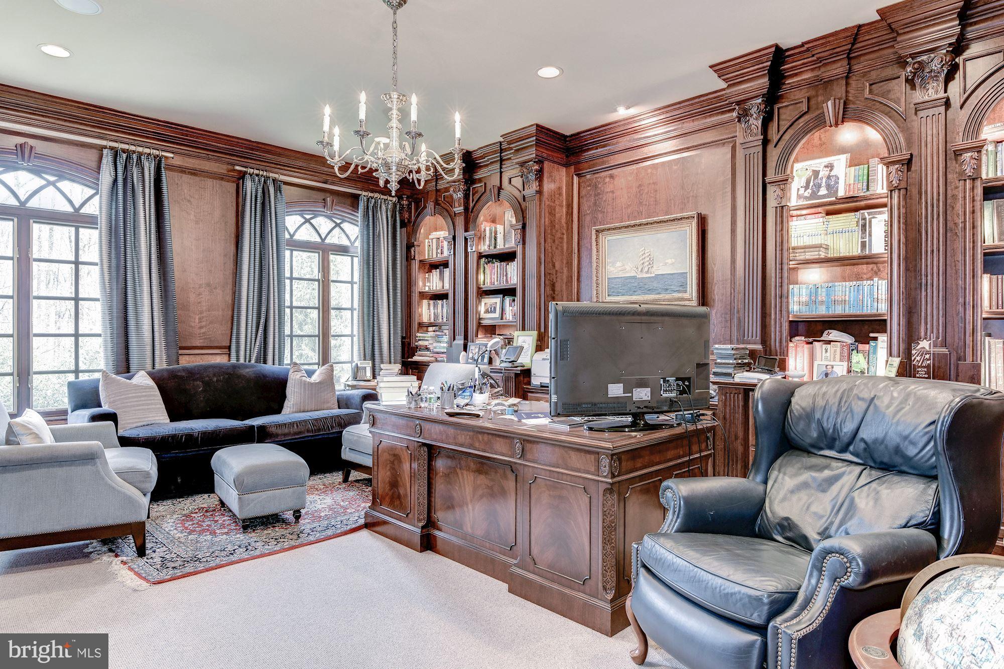 7712 Georgetown Pike McLean, VA 22102 - Photo 6 of 35 a living room with furniture and a chandelier