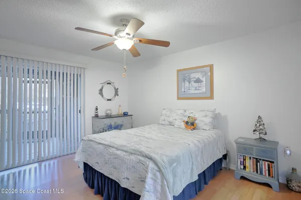 a bed room with a bed and a chandelier