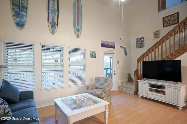 a living room with furniture and a flat screen tv