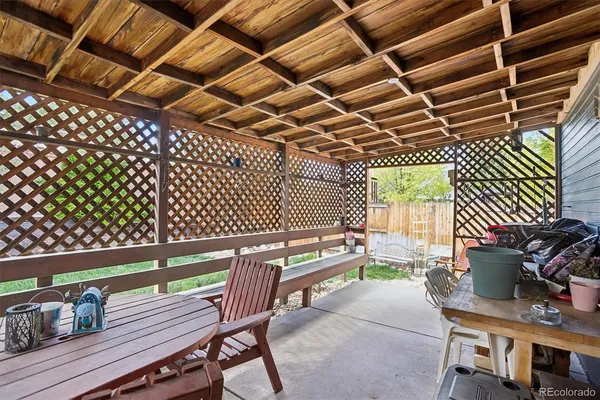 a view of a chairs and table in a patio