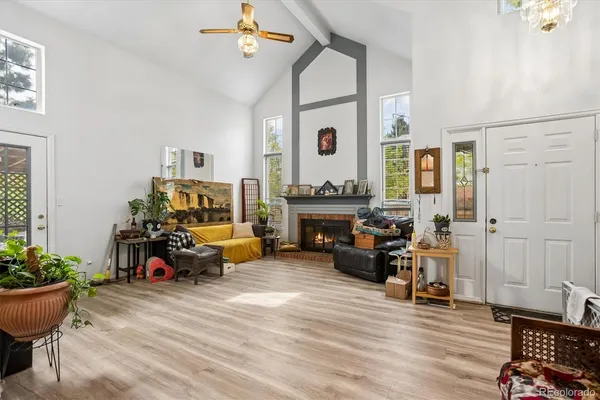 a living room with furniture and a fireplace