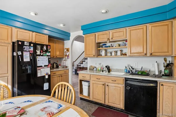 a kitchen with a sink cabinets and appliances