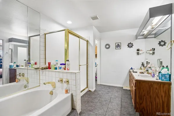a bathroom with a bathtub a sink and a window