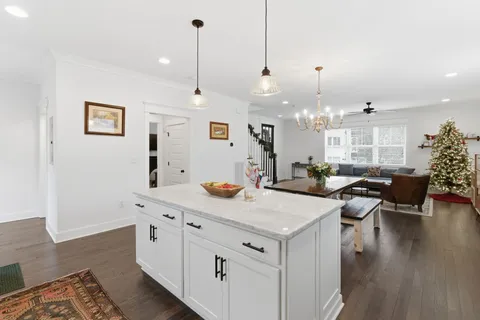 a bedroom with a bed and a ceiling fan