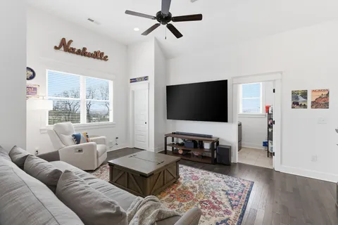 a bedroom with bed and a chandelier
