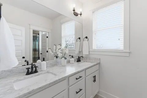 a bathroom with a tub and shower