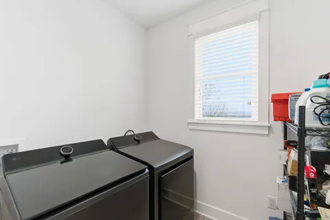 a view of a house with chairs and wooden floor