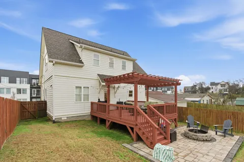 a balcony with furniture and wooden floor