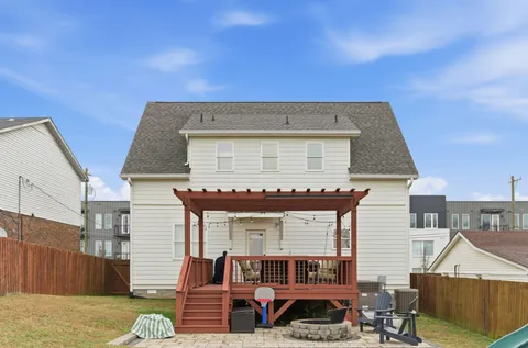 a view of a chairs and table in the balcony