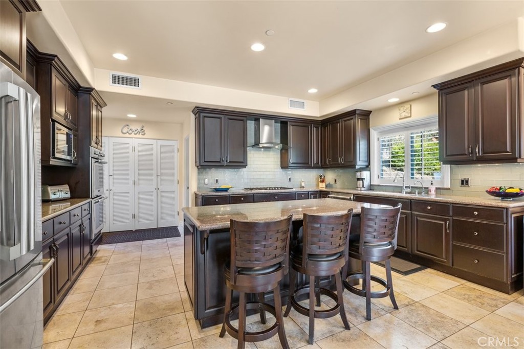 77 Altamont Way Camarillo, CA 93010 - Photo 11 of 48 a kitchen with a sink and cabinets