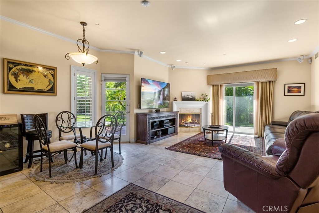 77 Altamont Way Camarillo, CA 93010 - Photo 12 of 48 a living room with furniture a fireplace and a dining table