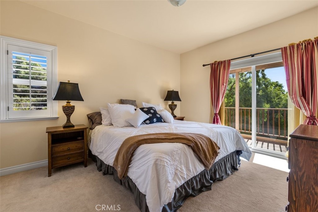 77 Altamont Way Camarillo, CA 93010 - Photo 21 of 48 a spacious bedroom with a bed and a large window